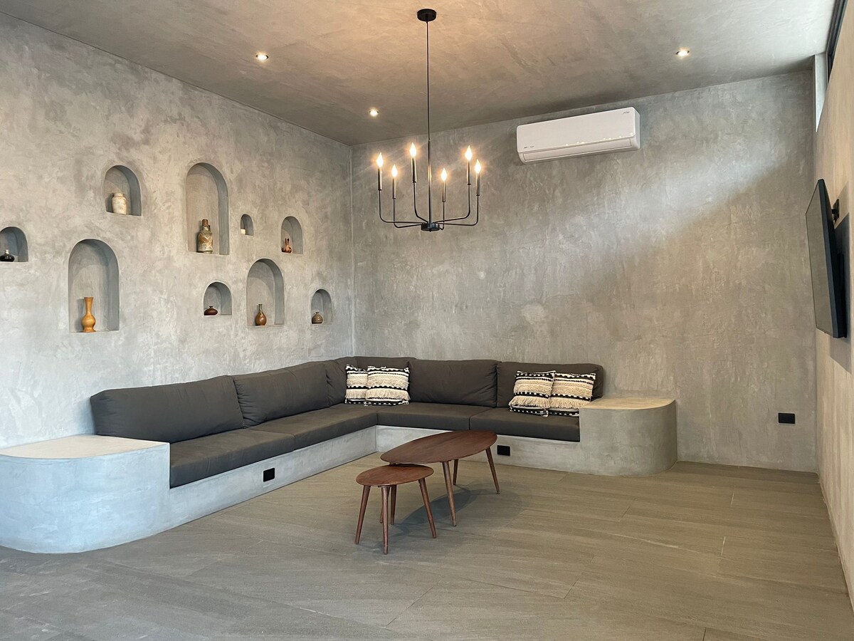 Casa Arroqueno sleek polished gray concrete interiors with minimalist gallery-like atmosphere