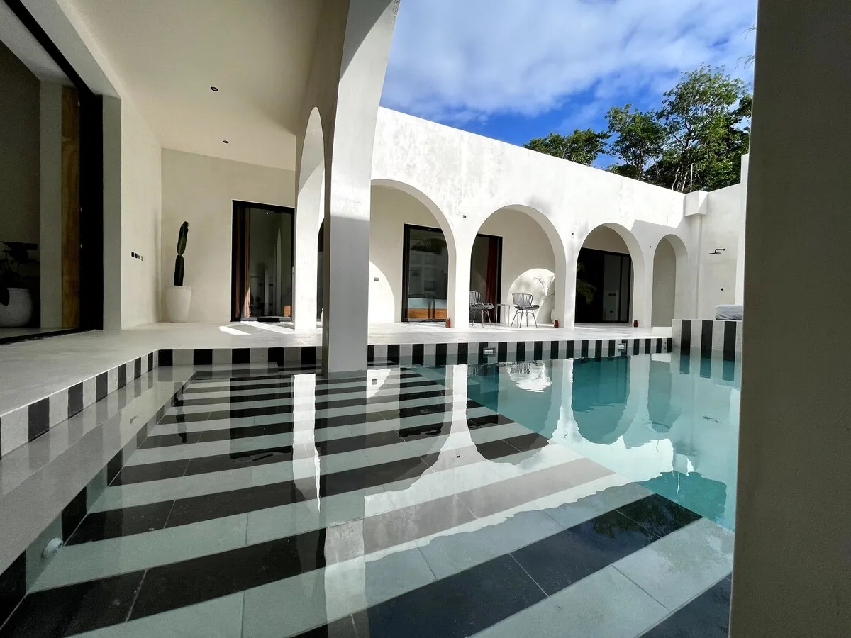 Casa Bali single-story modern tropical house with open-air design and natural materials