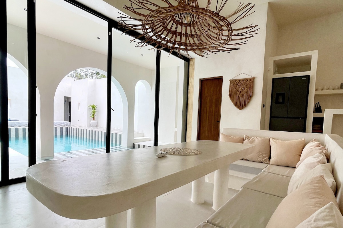 Casa Bali modern bathroom with tropical design elements and natural lighting