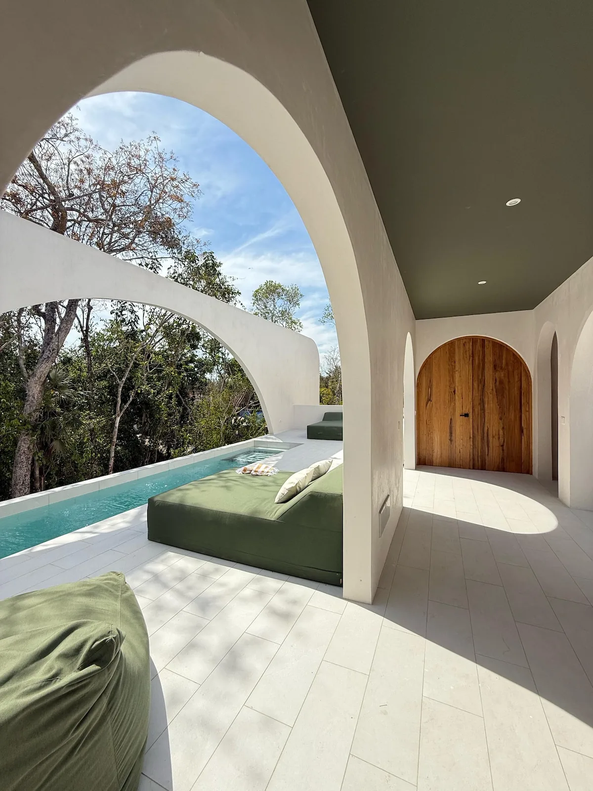 Casa Lancelot swimming pool area with tropical nature