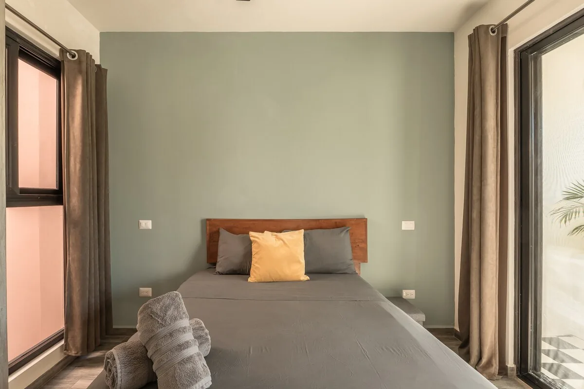 Casa Sueño outdoor terrace with dining area surrounded by lush jungle vegetation