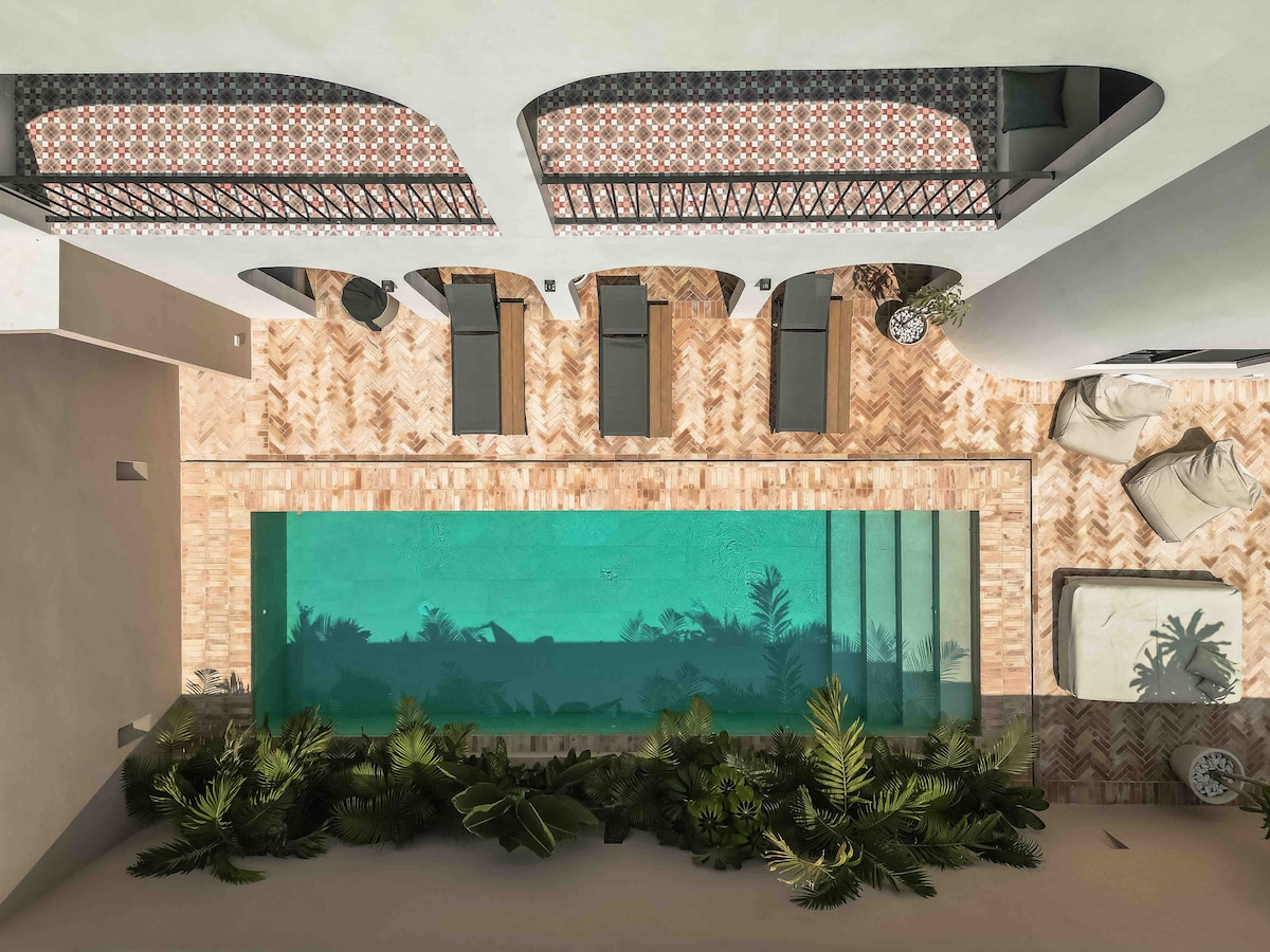 Casa Tabarka luxury swimming pool with modern design and tropical garden designed by Clémence