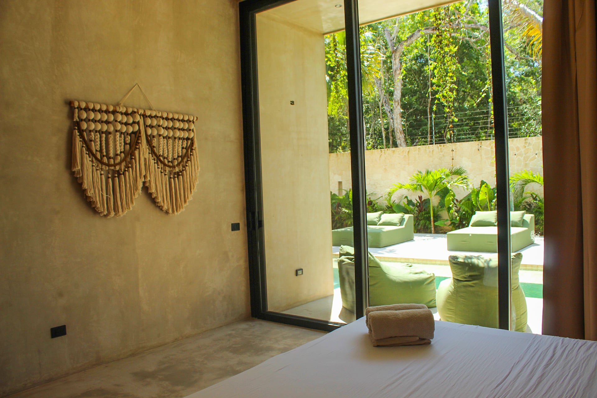 Casa Uulum living room with pool views