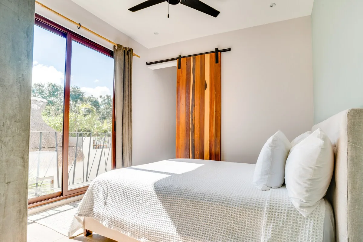 Casa Zorro contemporary bathroom with luxury fixtures and rainfall shower in Tulum rental property